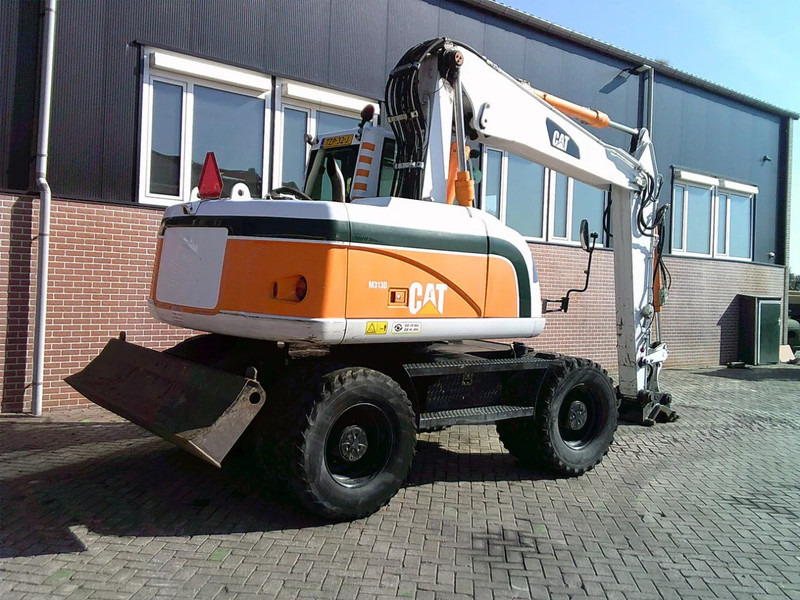 Caterpillar M313D - Ekskavator roda: gambar 4 Caterpillar M313D - Ekskavator roda: gambar 4