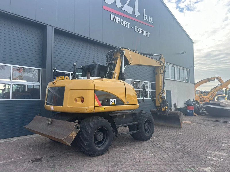 Caterpillar M313D - Ekskavator roda: gambar 4 Caterpillar M313D - Ekskavator roda: gambar 4