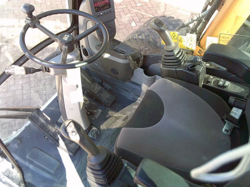 Ekskavator roda Caterpillar M313D: gambar 8