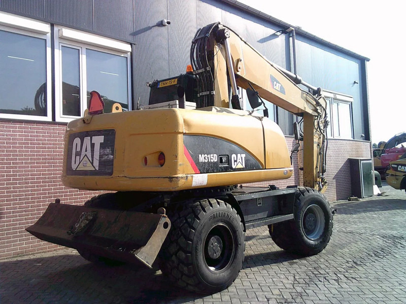 Caterpillar M315D - Ekskavator roda: gambar 3 Caterpillar M315D - Ekskavator roda: gambar 3