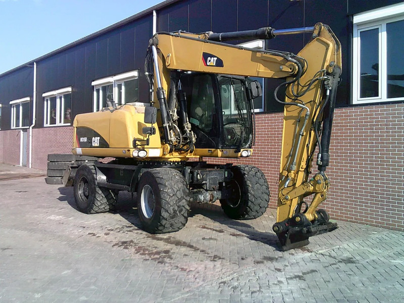 Caterpillar M315D - Ekskavator roda: gambar 4 Caterpillar M315D - Ekskavator roda: gambar 4
