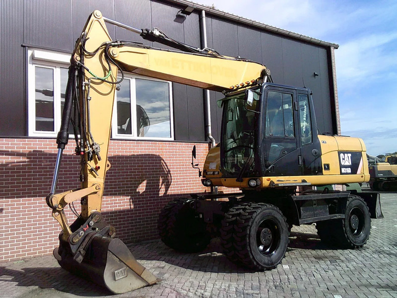 Caterpillar M316D - Ekskavator roda: gambar 1 Caterpillar M316D - Ekskavator roda: gambar 1