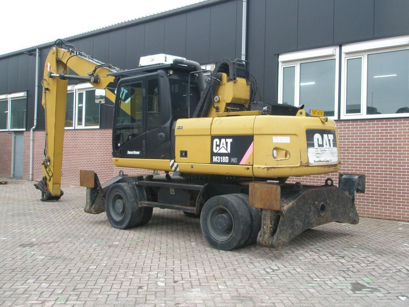 Caterpillar M318D - Ekskavator roda: gambar 2 Caterpillar M318D - Ekskavator roda: gambar 2