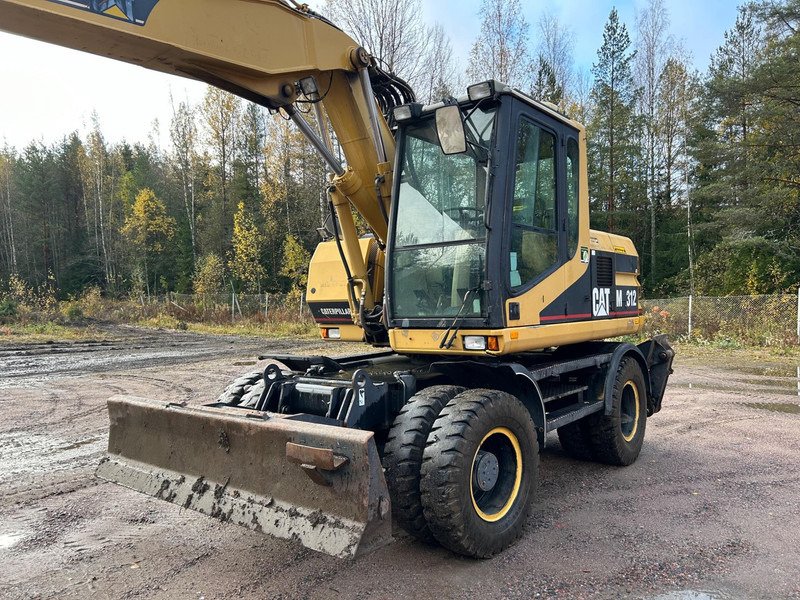 Caterpillar M312 Engcon EC20 tiltrotator - Ekskavator roda: gambar 2 Caterpillar M312 Engcon EC20 tiltrotator - Ekskavator roda: gambar 2
