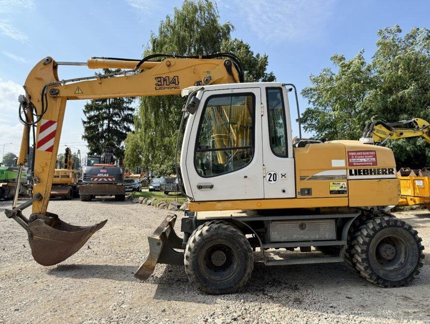 Liebherr A314 - Ekskavator roda: gambar 1 Liebherr A314 - Ekskavator roda: gambar 1