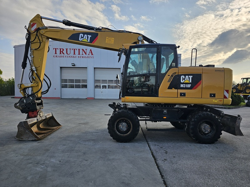 CATERPILLAR M318F - Ekskavator roda: gambar 1 CATERPILLAR M318F - Ekskavator roda: gambar 1