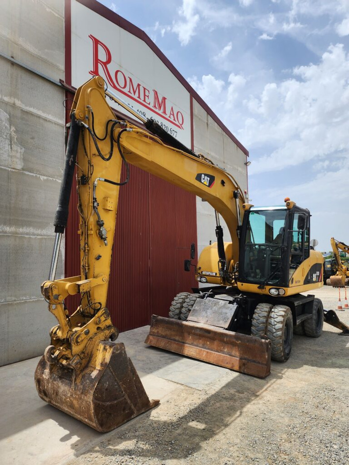 CAT M313D - Ekskavator roda: gambar 3 CAT M313D - Ekskavator roda: gambar 3
