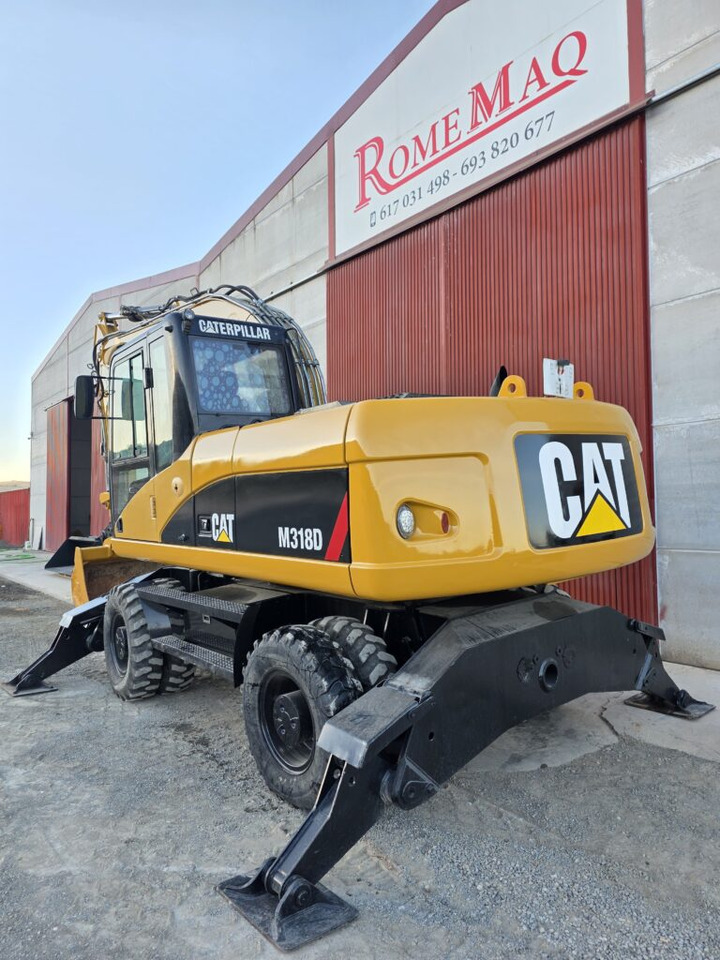 CAT M318D - Ekskavator roda: gambar 2 CAT M318D - Ekskavator roda: gambar 2