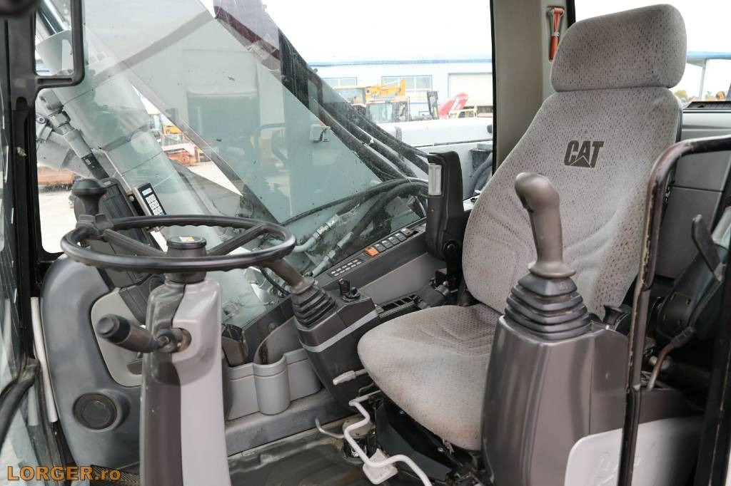 Ekskavator roda CAT M 313 D: gambar 11