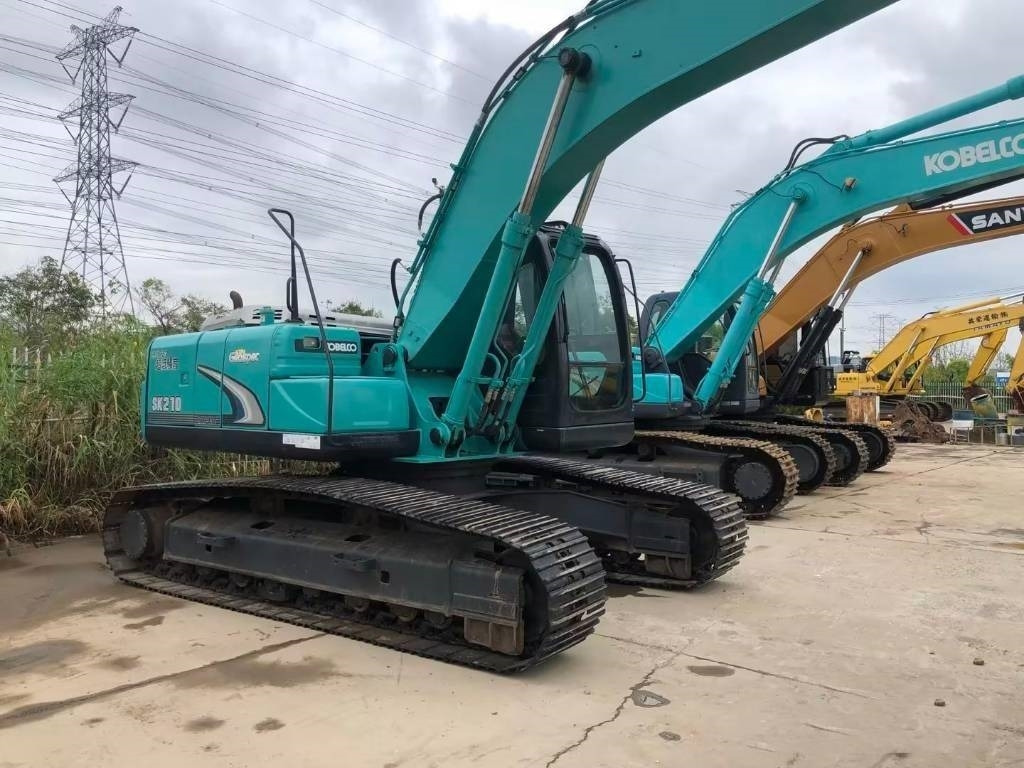Ekskavator perayap Kobelco SK 210: gambar 11