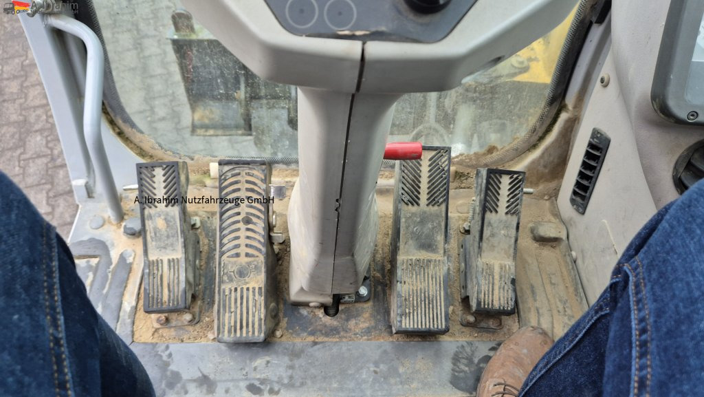 New Holland MH 2.6 Zustand gut, deutsche Maschine incl. Greifer und Dreservo - Ekskavator roda: gambar 5 New Holland MH 2.6 Zustand gut, deutsche Maschine incl. Greifer und Dreservo - Ekskavator roda: gambar 5