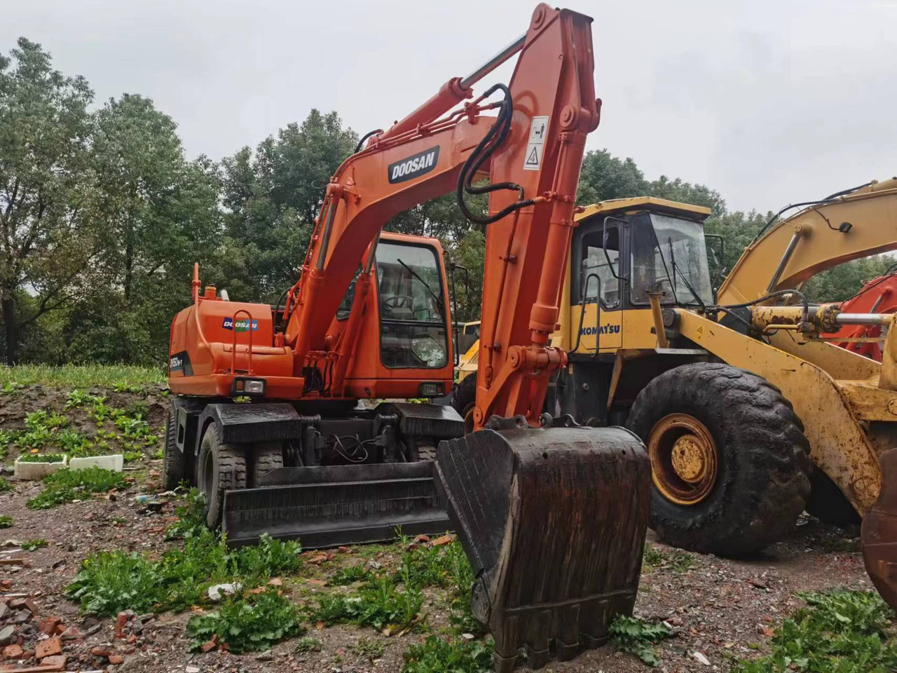 DOOSAN DH150W-7 - Ekskavator roda: gambar 1 DOOSAN DH150W-7 - Ekskavator roda: gambar 1