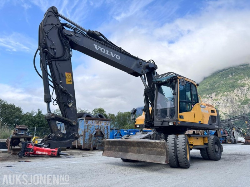 2018 Volvo EW210D Hjulgraver - S70 HK feste - Sentralsmøring - Hammerhydraulikk/tilleggshydraulikk - Multi-X - 1 tannskuffe - Ekskavator: gambar 1 2018 Volvo EW210D Hjulgraver - S70 HK feste - Sentralsmøring - Hammerhydraulikk/tilleggshydraulikk - Multi-X - 1 tannskuffe - Ekskavator: gambar 1