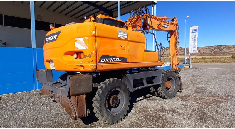 Doosan DX140W-3 - Ekskavator roda: gambar 4 Doosan DX140W-3 - Ekskavator roda: gambar 4