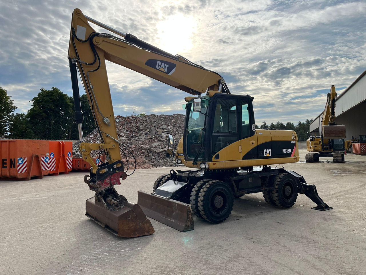 Caterpillar M318D - Ekskavator roda: gambar 5 Caterpillar M318D - Ekskavator roda: gambar 5
