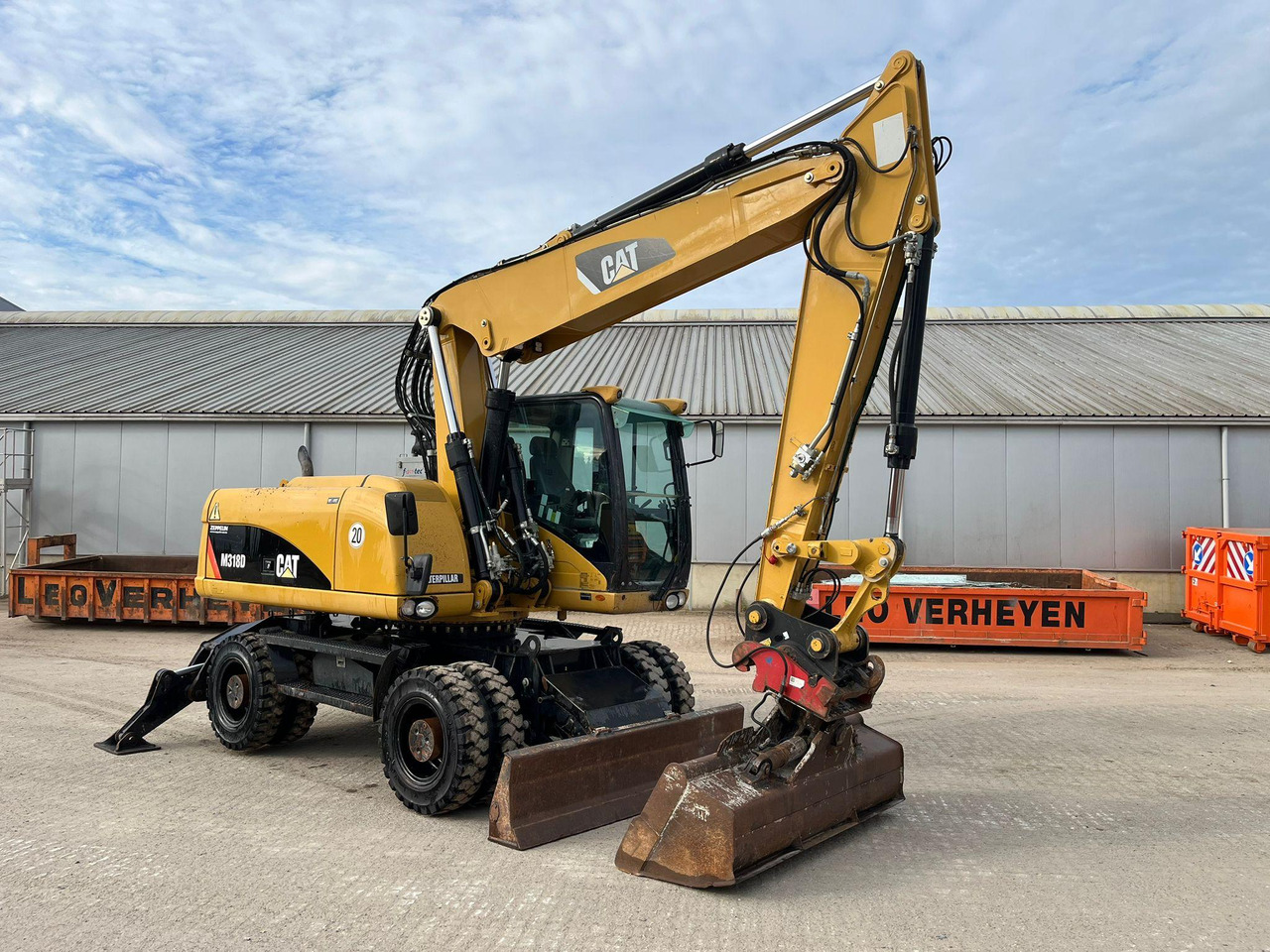 Caterpillar M318D - Ekskavator roda: gambar 1 Caterpillar M318D - Ekskavator roda: gambar 1