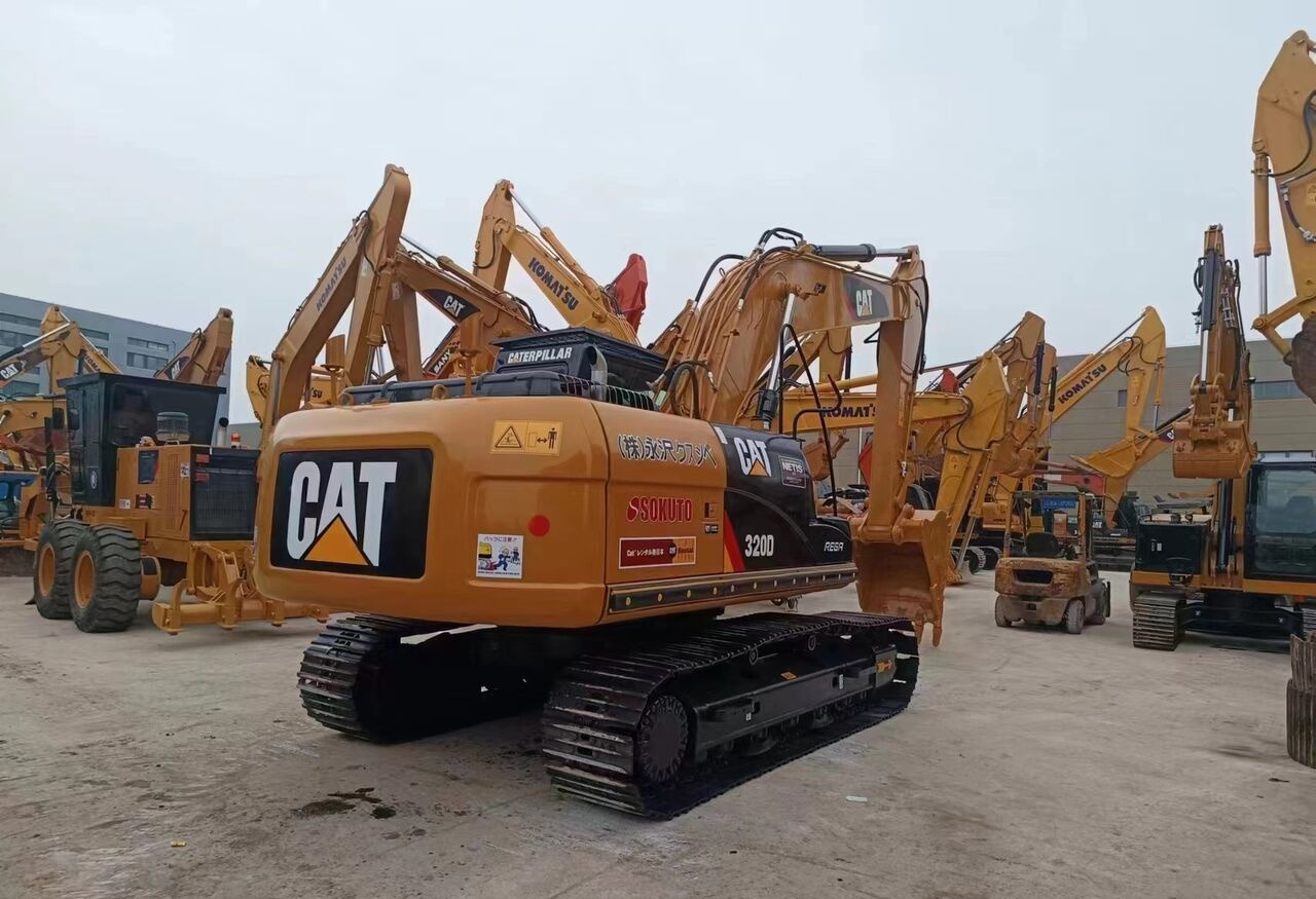 Caterpillar 320D - Ekskavator roda: gambar 2 Caterpillar 320D - Ekskavator roda: gambar 2
