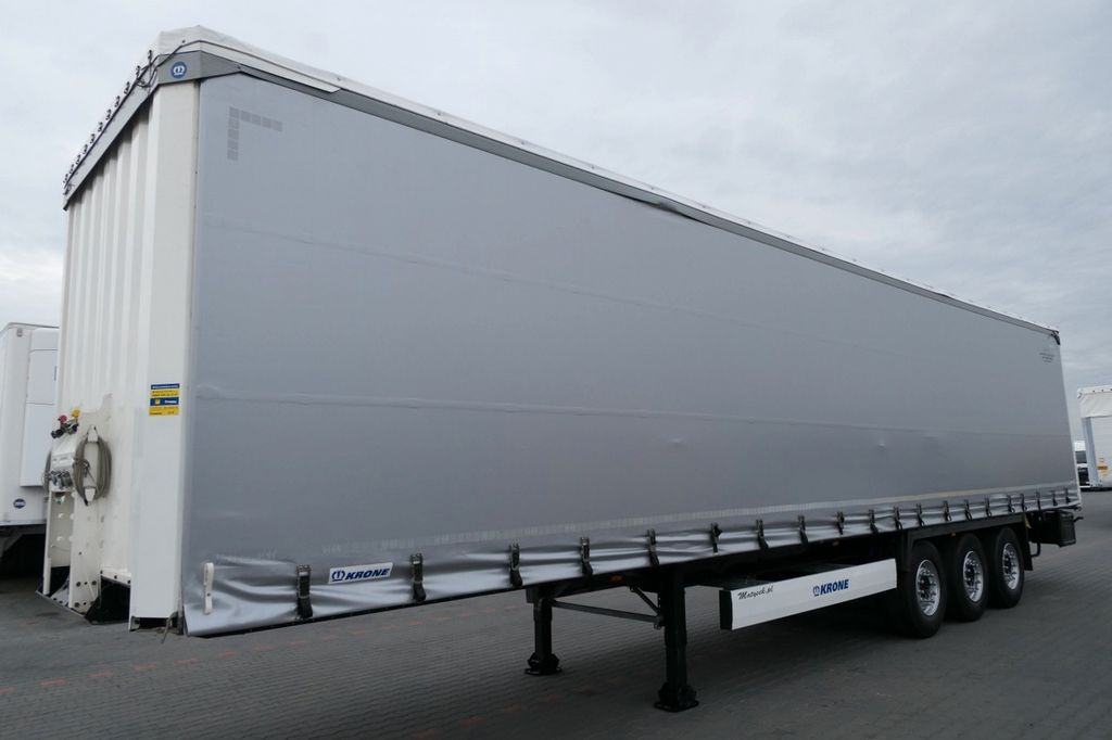 Krone CURTAINSIDER /STANDARD/LIFT ROOF & AXLE Krone CURTAINSIDER /STANDARD/LIFT ROOF & AXLE - Semi-trailer dengan terpal samping: gambar 2 Krone CURTAINSIDER /STANDARD/LIFT ROOF & AXLE Krone CURTAINSIDER /STANDARD/LIFT ROOF & AXLE - Semi-trailer dengan terpal samping: gambar 2