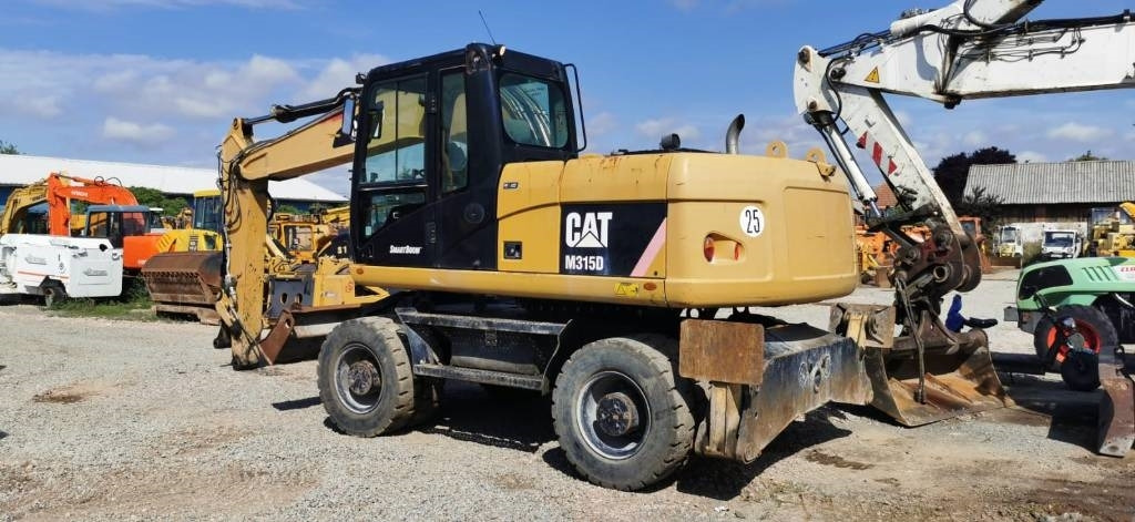 CAT M 315 D - Ekskavator roda: gambar 5 CAT M 315 D - Ekskavator roda: gambar 5