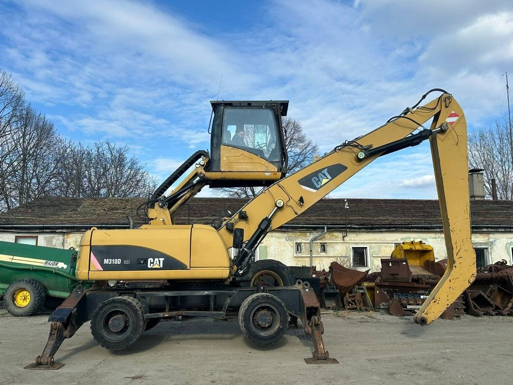 Mesin pengisi CAT M 318 D MH: gambar 6 Mesin pengisi CAT M 318 D MH: gambar 6