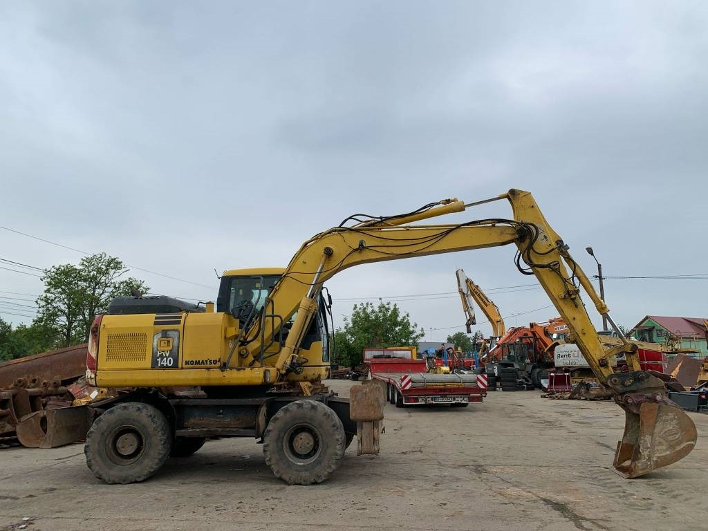 Ekskavator roda Komatsu PW 140-7: gambar 6 Ekskavator roda Komatsu PW 140-7: gambar 6