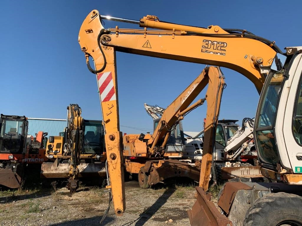 Liebherr A 312 - Ekskavator roda: gambar 4 Liebherr A 312 - Ekskavator roda: gambar 4