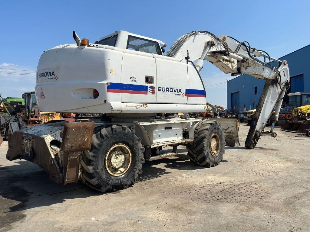 New Holland MH Plus - Ekskavator roda: gambar 4 New Holland MH Plus - Ekskavator roda: gambar 4