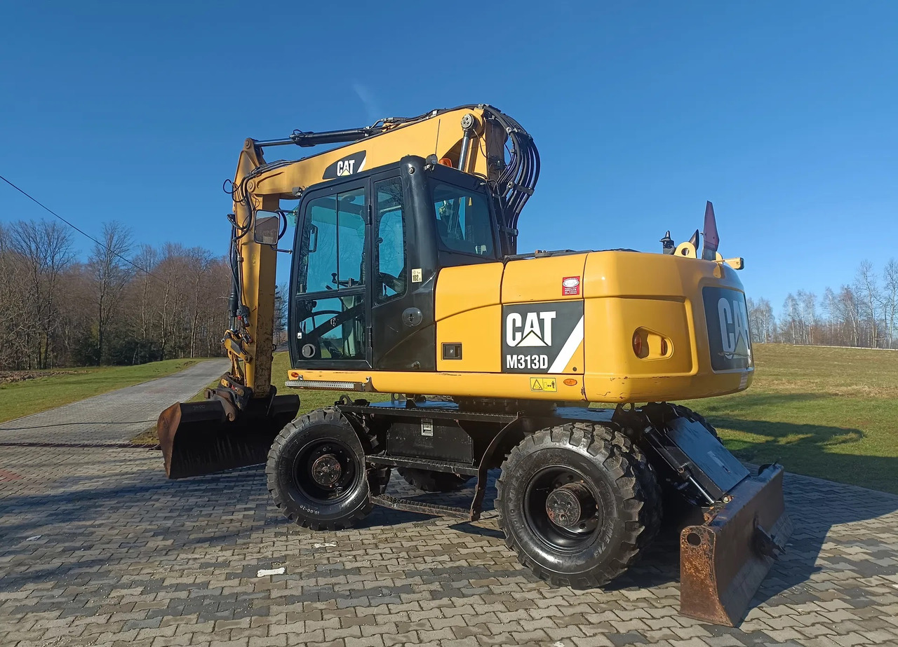CATERPILLAR M313D - Ekskavator roda: gambar 1 CATERPILLAR M313D - Ekskavator roda: gambar 1