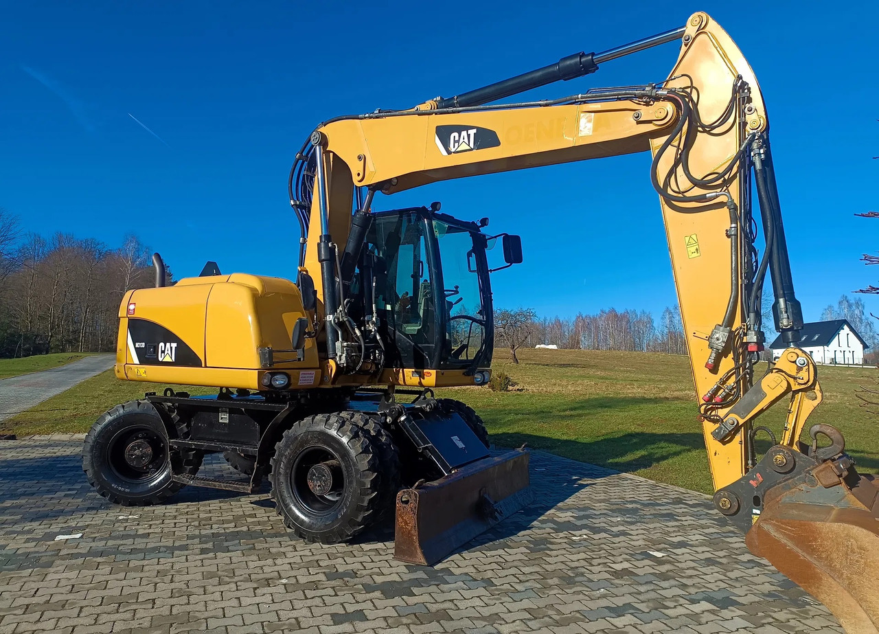 CATERPILLAR M313D - Ekskavator roda: gambar 2 CATERPILLAR M313D - Ekskavator roda: gambar 2