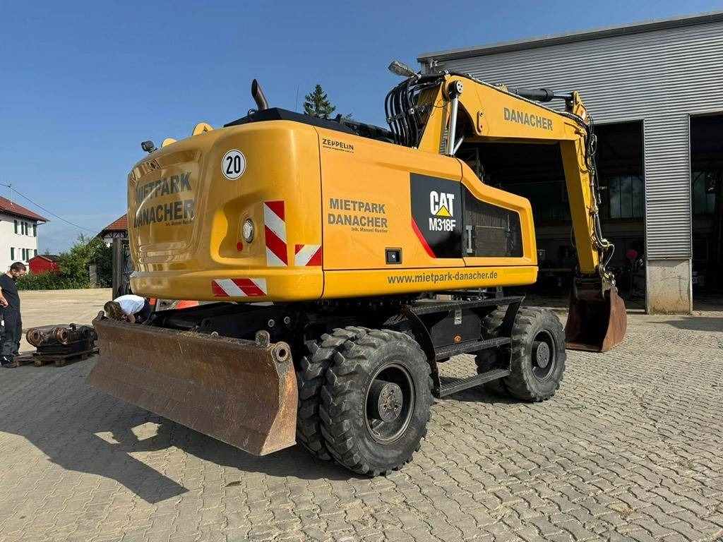 CAT M 318 F - Ekskavator roda: gambar 5 CAT M 318 F - Ekskavator roda: gambar 5
