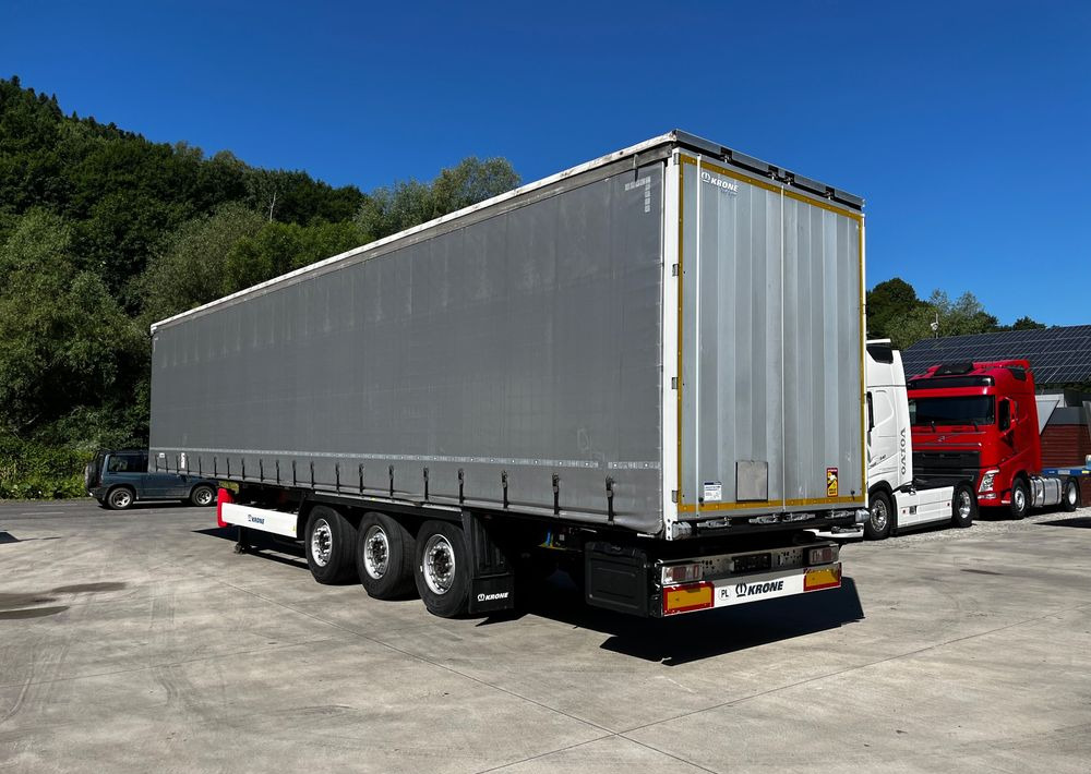 Krone Firanka Coilmulde // 9m // Alu Drzwi // Ażury // Oś podnoszona // - Semi-trailer dengan terpal samping: gambar 3 Krone Firanka Coilmulde // 9m // Alu Drzwi // Ażury // Oś podnoszona // - Semi-trailer dengan terpal samping: gambar 3