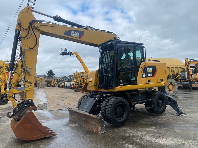Caterpillar M316F NVT - Ekskavator roda: gambar 1 Caterpillar M316F NVT - Ekskavator roda: gambar 1