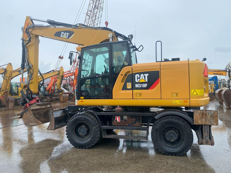 Caterpillar M318F NVT - Ekskavator roda: gambar 1 Caterpillar M318F NVT - Ekskavator roda: gambar 1