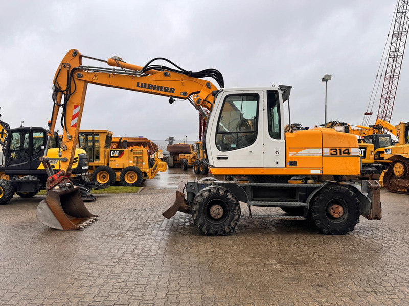 Liebherr A 314 Litronic . - Ekskavator roda: gambar 1 Liebherr A 314 Litronic . - Ekskavator roda: gambar 1