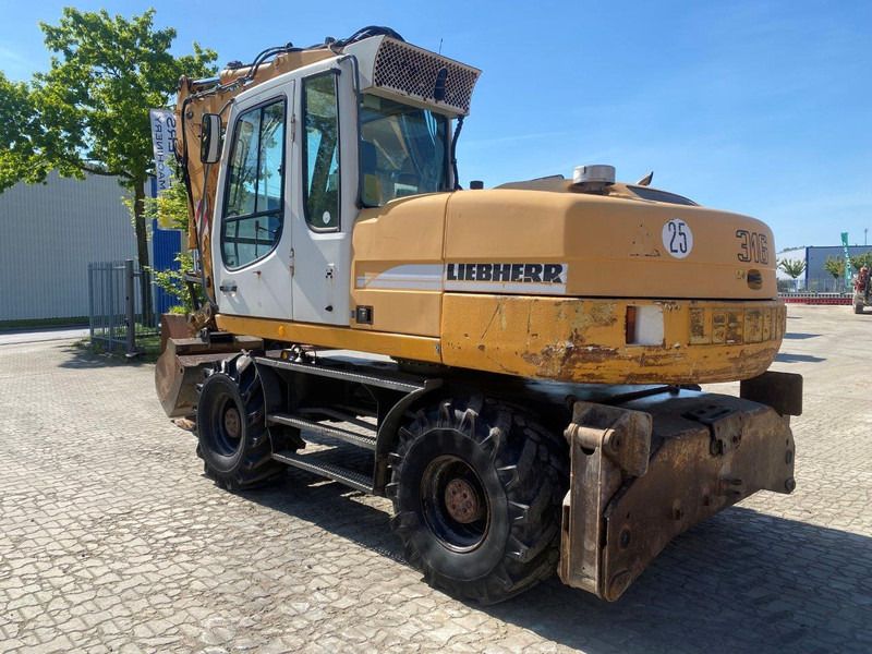 Liebherr A316 Litronic . - Ekskavator roda: gambar 1 Liebherr A316 Litronic . - Ekskavator roda: gambar 1