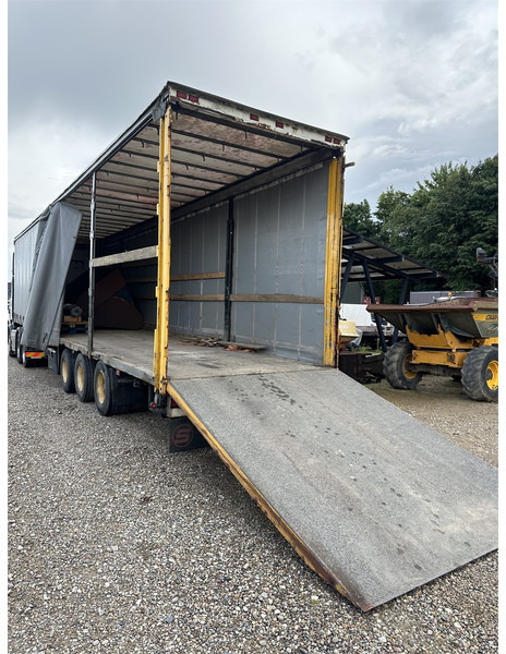 Schmitz Cargobull Machine transport trailer with bag ramp - Semi-trailer: gambar 1 Schmitz Cargobull Machine transport trailer with bag ramp - Semi-trailer: gambar 1