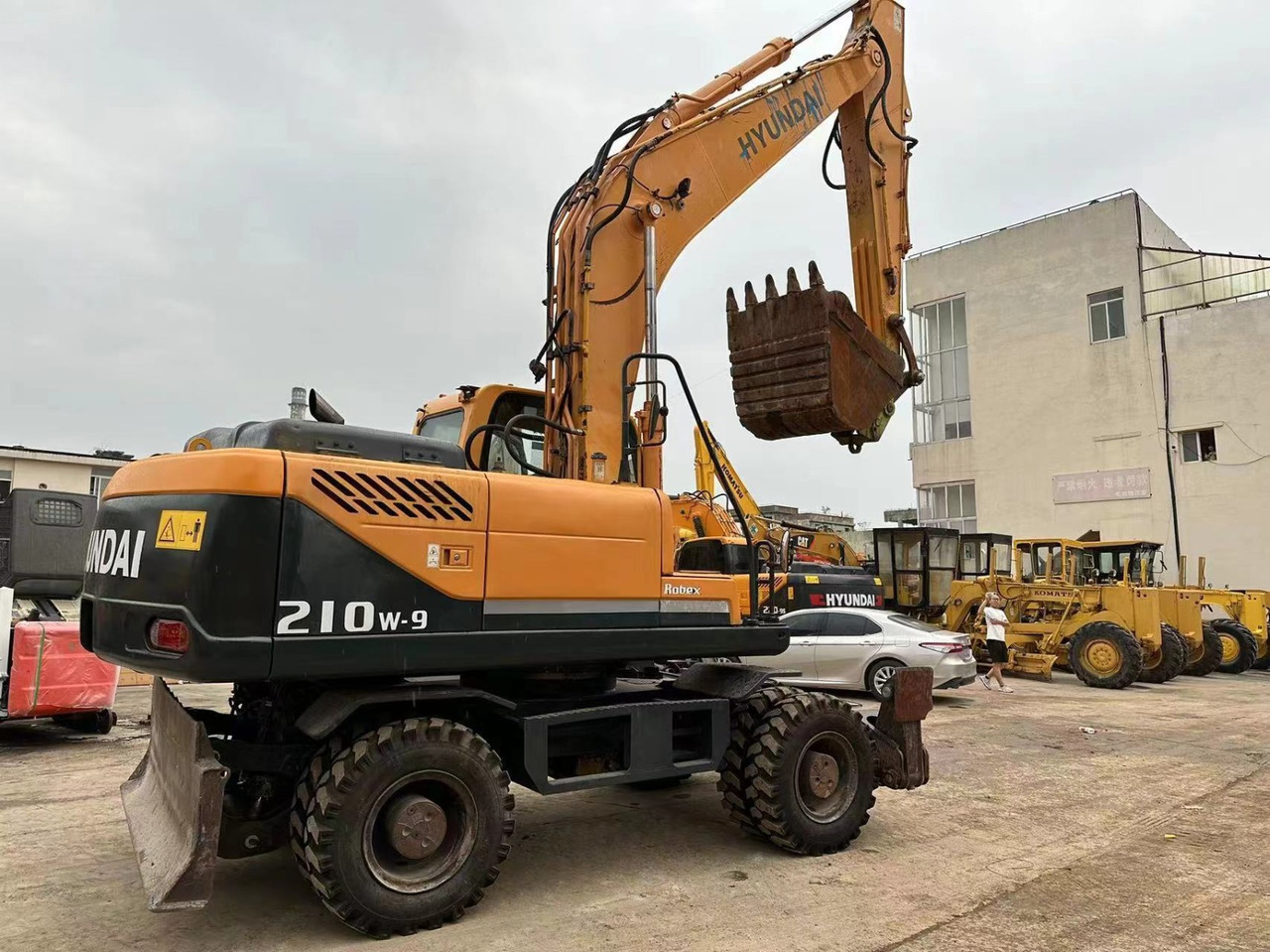 Hyundai 210w-9 - Ekskavator roda: gambar 2 Hyundai 210w-9 - Ekskavator roda: gambar 2