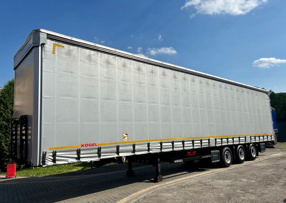 Kögel MEGA 2019 OPONY 80% SAF PODNOSZONA OŚ PODNOSZONY DACH / OD PIERWSZEGO WŁAŚCICIELA - Semi-trailer dengan terpal samping: gambar 1 Kögel MEGA 2019 OPONY 80% SAF PODNOSZONA OŚ PODNOSZONY DACH / OD PIERWSZEGO WŁAŚCICIELA - Semi-trailer dengan terpal samping: gambar 1