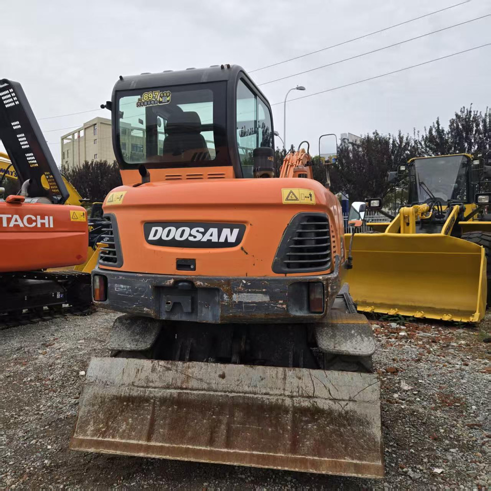 DOOSAN DX60W - Ekskavator roda: gambar 4 DOOSAN DX60W - Ekskavator roda: gambar 4