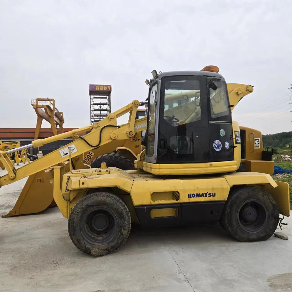 KOMATSU PC128US - Ekskavator roda: gambar 2 KOMATSU PC128US - Ekskavator roda: gambar 2