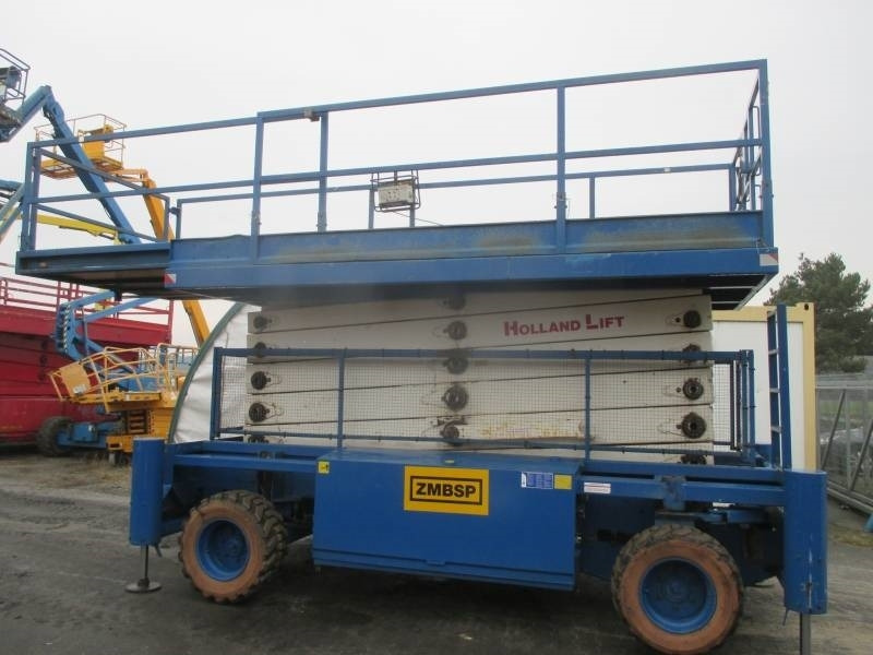 Holland Lift B 195 DL 25 - Scissor lifts: gambar 2 Holland Lift B 195 DL 25 - Scissor lifts: gambar 2