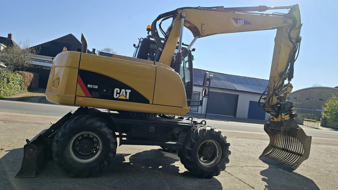 CATERPILLAR M313D - Ekskavator roda: gambar 4 CATERPILLAR M313D - Ekskavator roda: gambar 4