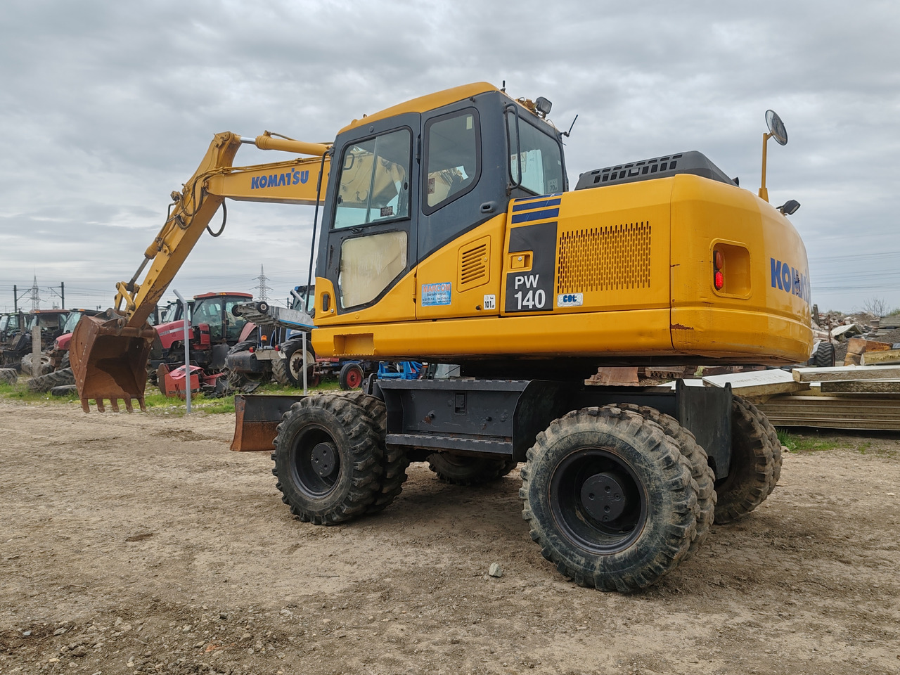 Komatsu PW140-7 - Ekskavator roda: gambar 5 Komatsu PW140-7 - Ekskavator roda: gambar 5