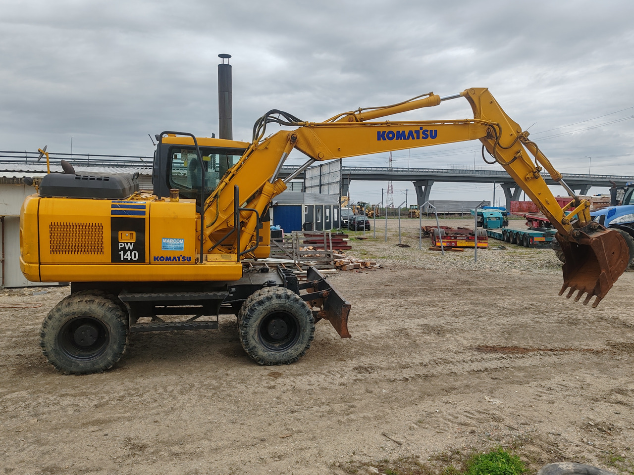 Komatsu PW140-7 - Ekskavator roda: gambar 4 Komatsu PW140-7 - Ekskavator roda: gambar 4
