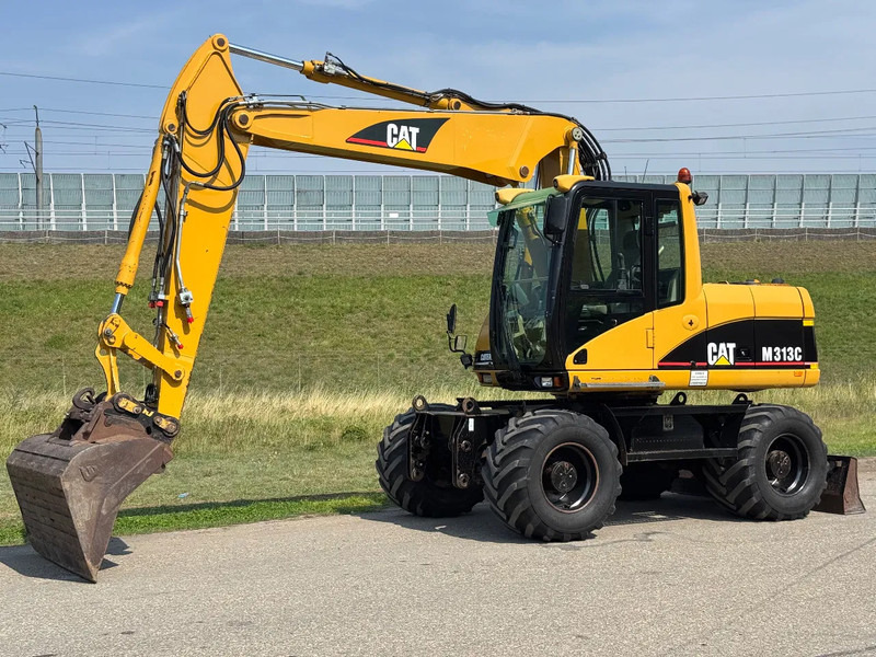 Caterpillar M313C - Ekskavator roda: gambar 1 Caterpillar M313C - Ekskavator roda: gambar 1