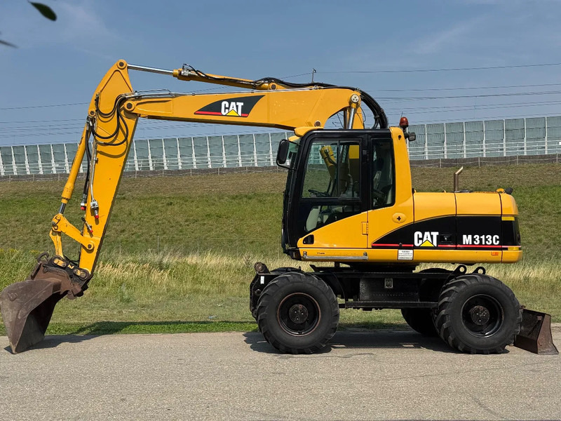 Caterpillar M313C - Ekskavator roda: gambar 2 Caterpillar M313C - Ekskavator roda: gambar 2