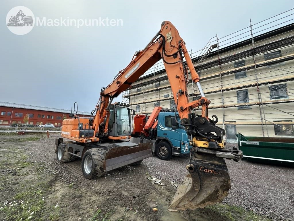 Doosan DX 140 W med vagn och redskap - Ekskavator roda: gambar 2 Doosan DX 140 W med vagn och redskap - Ekskavator roda: gambar 2