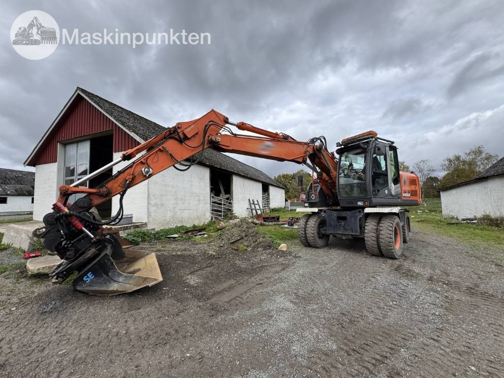 Hitachi ZX 140 W-3 - Ekskavator roda: gambar 1 Hitachi ZX 140 W-3 - Ekskavator roda: gambar 1