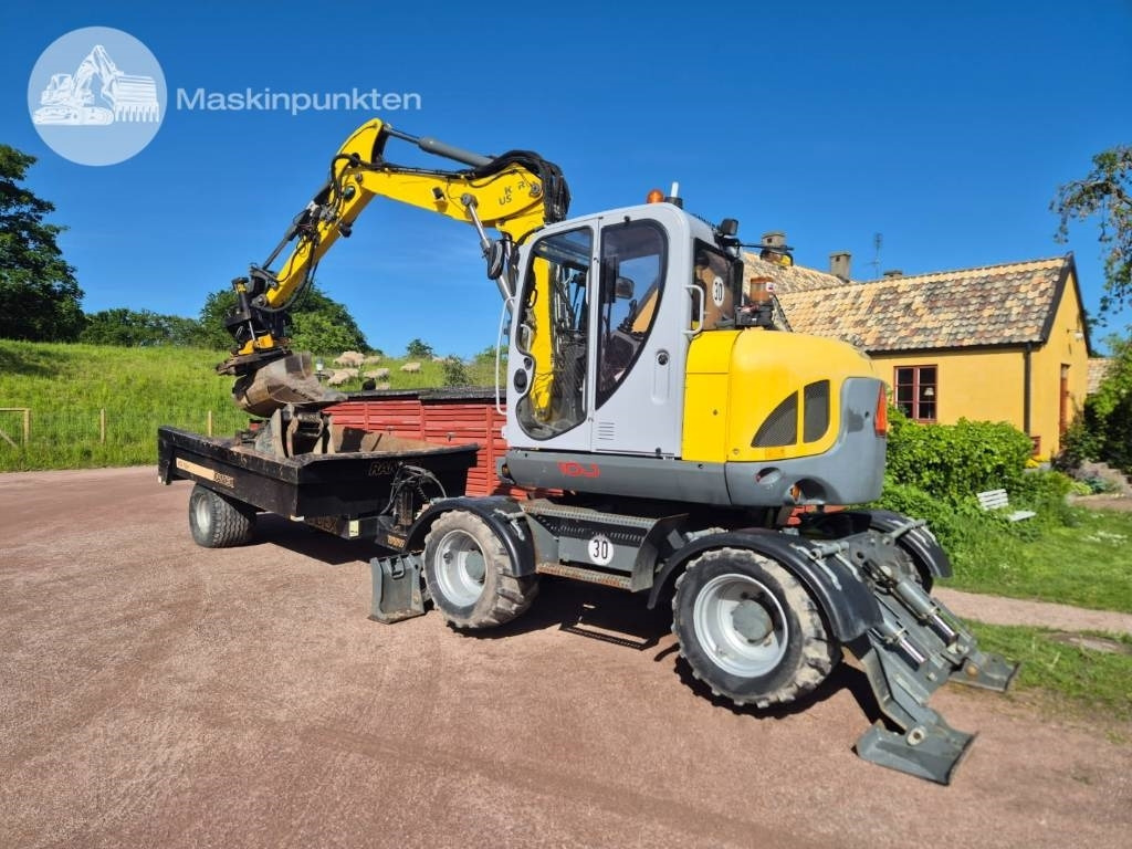 Wacker Neuson EW 100 med vagn - Ekskavator roda: gambar 2 Wacker Neuson EW 100 med vagn - Ekskavator roda: gambar 2