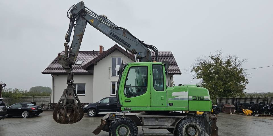 Koparka kołowa Liebherr A 316 Litronic chwytak podpory pług - Ekskavator roda: gambar 1 Koparka kołowa Liebherr A 316 Litronic chwytak podpory pług - Ekskavator roda: gambar 1